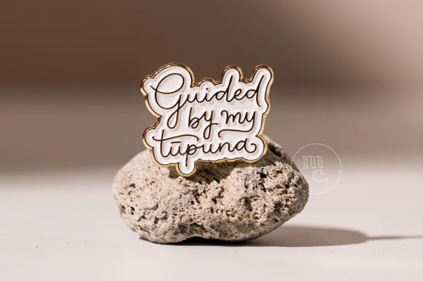 GUIDED BY ENAMEL PIN.