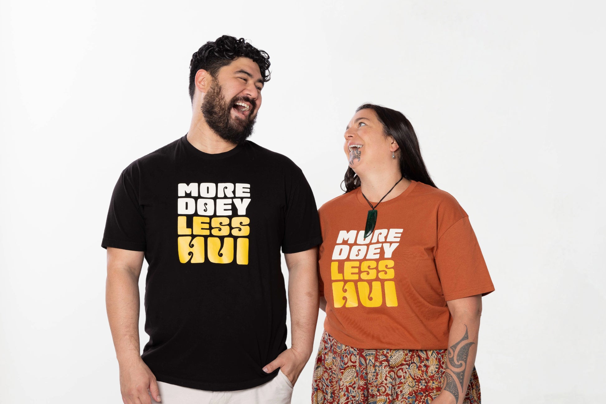 Models wearing the More Doey Less Hui tee – unisex, Māori-inspired cotton/polyester hoodie for everyday NZ wear.