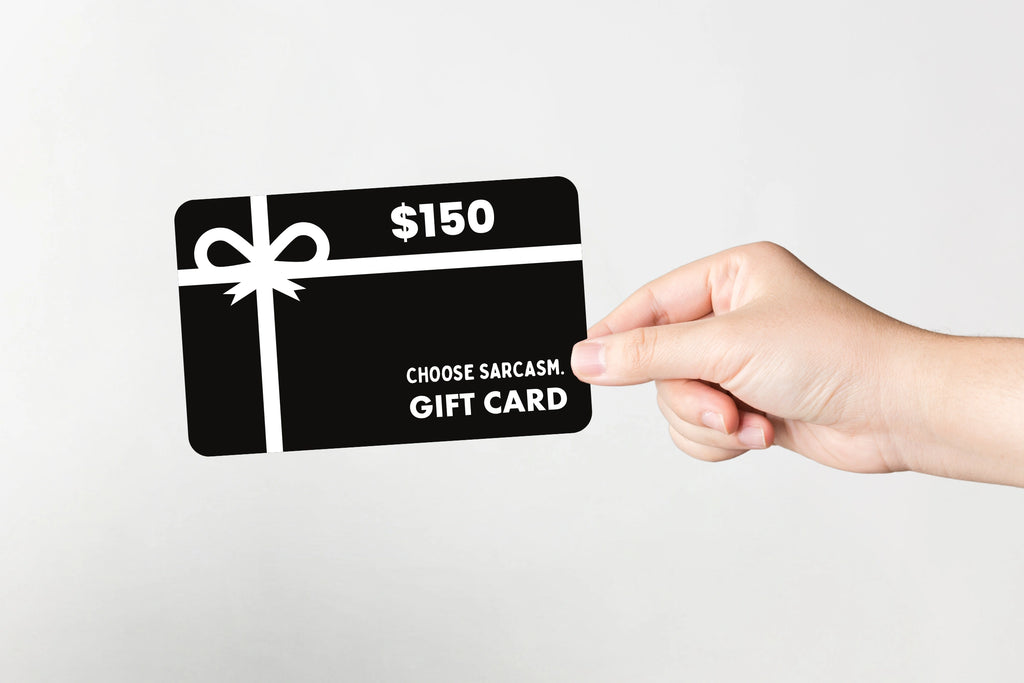 Flat lay of CHOOSE SARCASM gift card valued at $150.