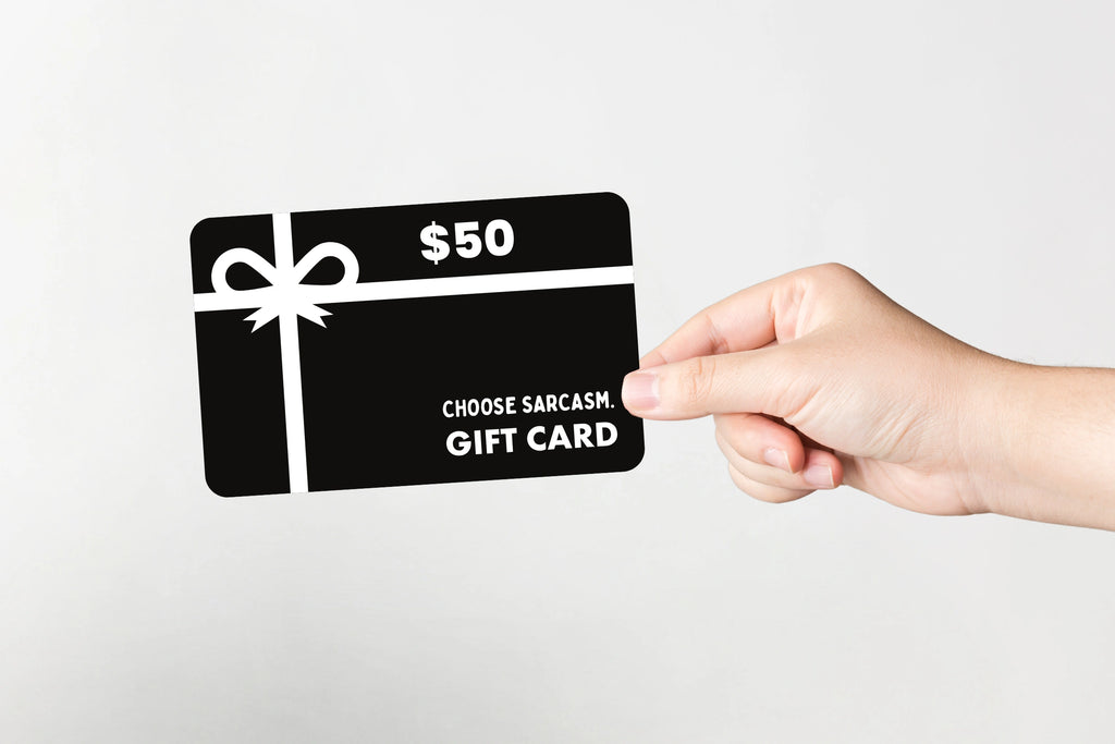 Flat lay of CHOOSE SARCASM gift card valued at $50.
