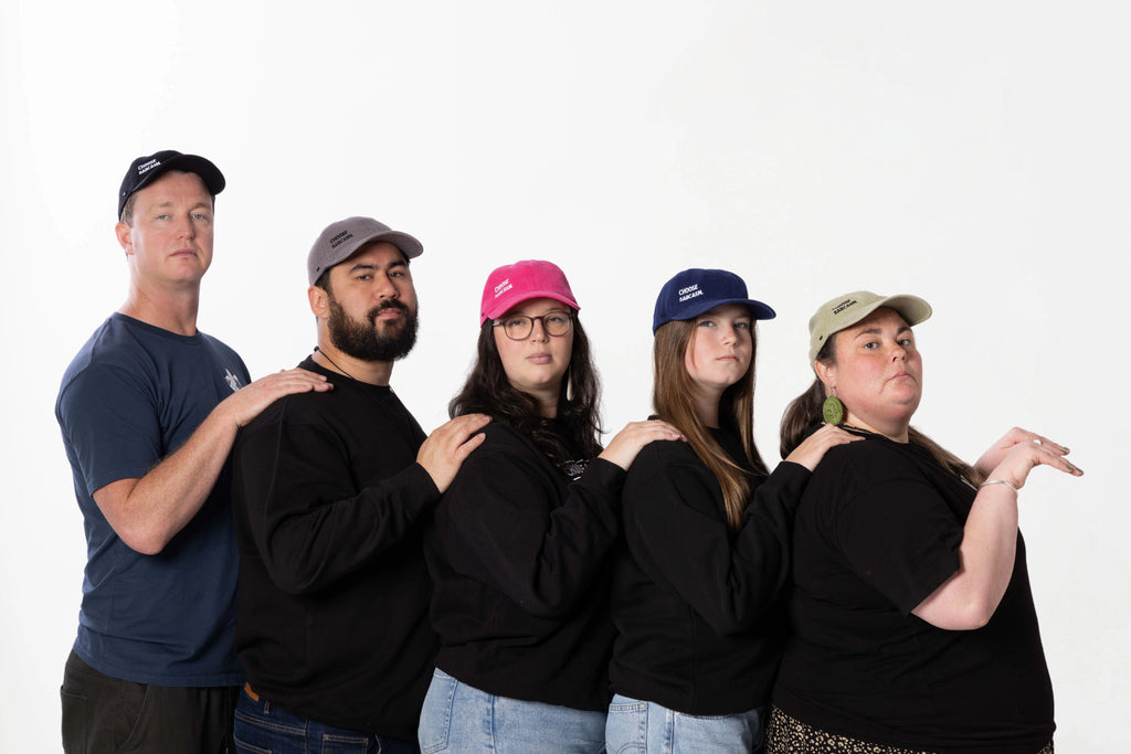 Models wearing the CHOOSE SARCASM cotton canvas cap – 100% heavy cotton canvas, unisex, one size fits all.