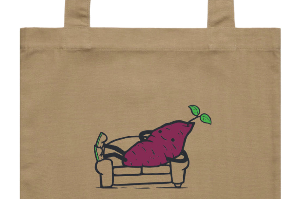 Flat lay of the Couch Kūmara Tote Bag – durable, eco-friendly, and designed for everyday errands or mahi. Perfect for carrying kai, gear, or your mental baggage.