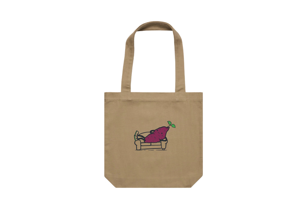 Flat lay of the Couch Kūmara Tote Bag – durable, eco-friendly, and designed for everyday errands or mahi. Perfect for carrying kai, gear, or your mental baggage.
