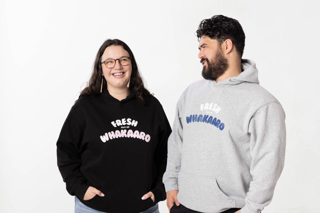 Models wearing the Fresh out of Whakaaro Hoodie – unisex, Māori-inspired cotton/polyester hoodie for everyday NZ wear.