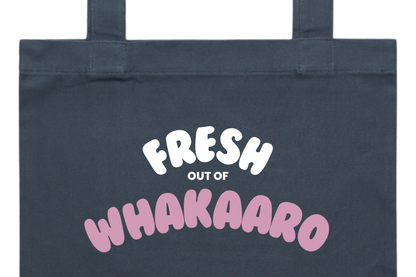 Flat lay of the FRESH OUT OF WHAKAARO tote bag, part of our Māori clothing and accessories for women and men.