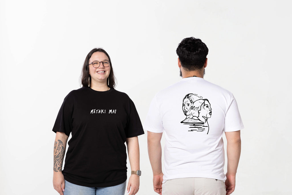 Two people wearing black and white t-shirts with text and graphics on a white background